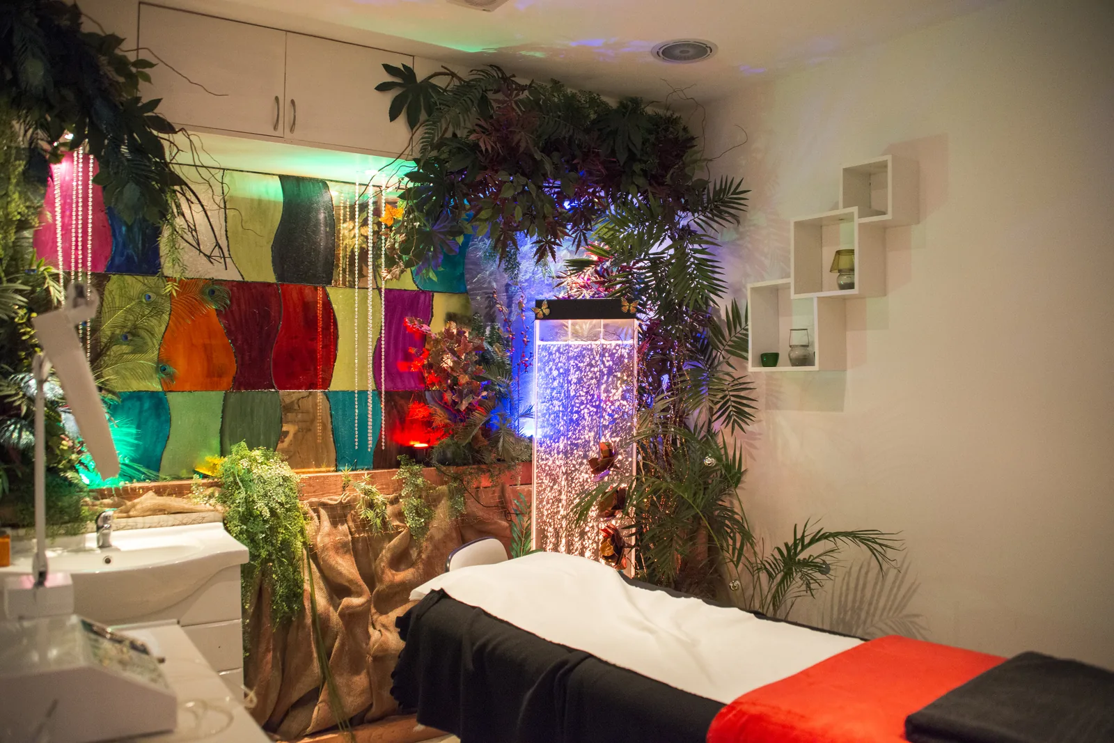 A themed facial room with a scenic backdrop and decorative lighting